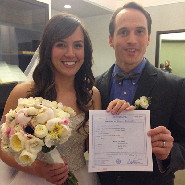 Happy couple with marriage license